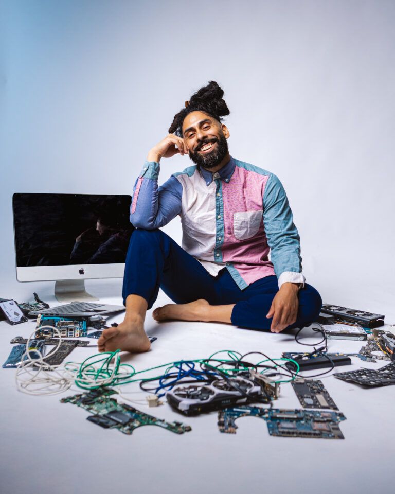 Carlos Diaz, Fresno computer repair technician, with computer parts